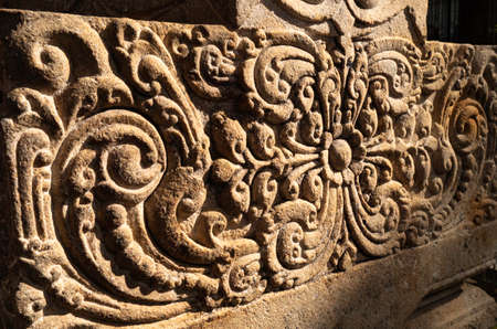 Detail of stone carving on the walls of an old church.の写真素材