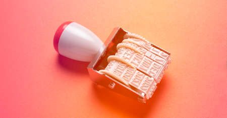 Top view of white wafer biscuit with cream on pink background