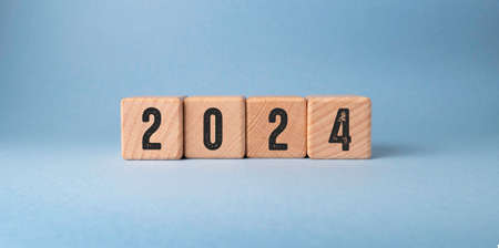 2022 new year concept. Wooden cubes with numbers on a blue background.