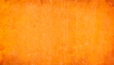 Grunge orange background with space for your text or image.の写真素材