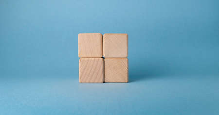 Wooden cubes with empty space on blue background. Business concept.の写真素材