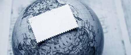 Blank paper note on the globe. Travel and tourism concept.の写真素材