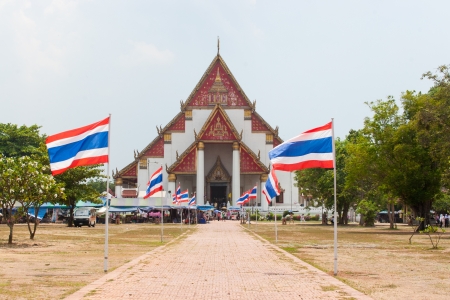 THAILAND - MAY 1  Viharn Phra Mongkol Bophit and Thailand flag, Ayutthaya, Thailand on May 1, 2010  Labour Day in Thailand  のeditorial素材
