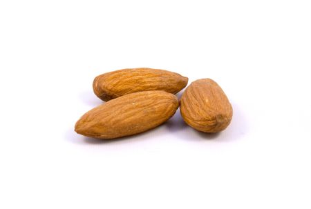 group of almonds isolated on whiteの写真素材