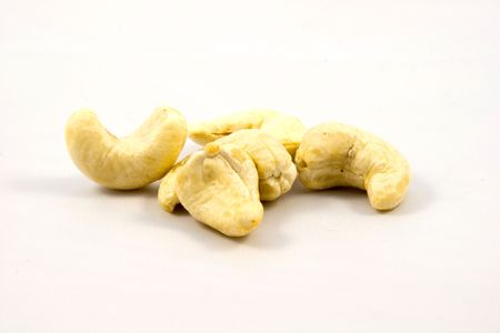 Cashew nuts isolated on white backgroundの写真素材