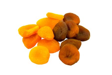 dried natural and sulpfured apricots isolated on white backgroundの写真素材