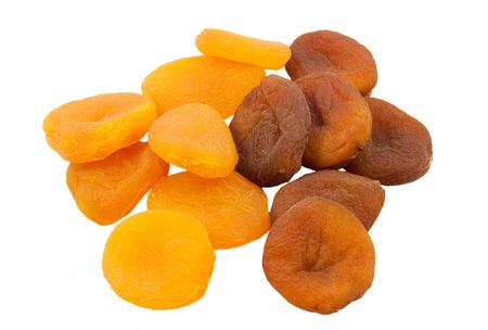 dried natural and sulpfured apricots isolated on white backgroundの写真素材