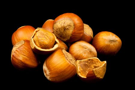 Hazelnuts on black backgroundの写真素材