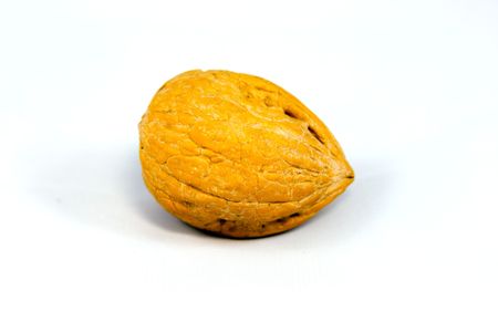 Walnut in shell isolated on whiteの写真素材