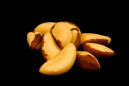 Brazil nuts isolated on blackの写真素材