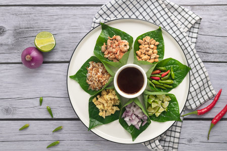 Miang kham - A royal leaf wrap appetizer - It is a traditional Southeast Asian snack from Thailand and Laos.の写真素材