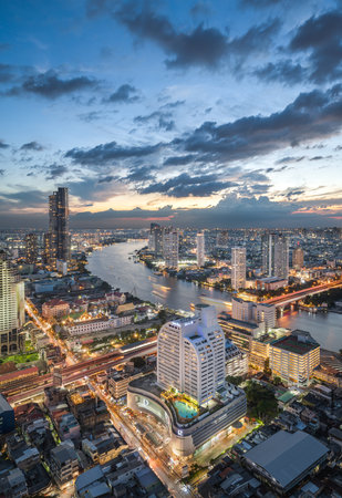 BANGKOK, October 31 : Curve of Chao Phraya River and river side view,  with a colorful twilight sky. from State Tower on October 31, 2023. Bangkok is the capital and the most populous city of Thailand.のeditorial素材