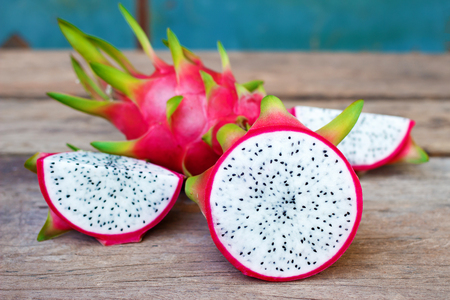 Dragon fruit on old wooden tableの写真素材
