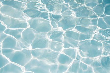 Texture of water in swimming pool for backgroundの写真素材