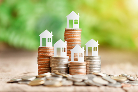 House model on coins stack for saving to buy a houseの写真素材