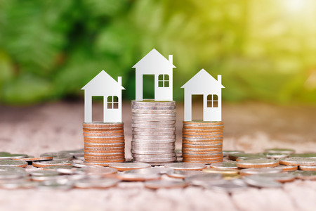 House model on coins stack for saving to buy a houseの写真素材
