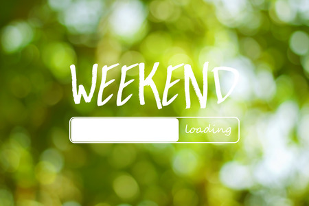 Weekend loading word on green  light bokeh backgroundの写真素材