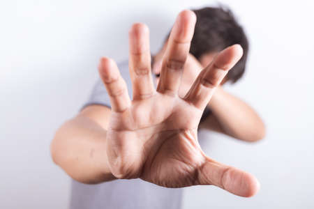 Sad man scared use hands to close the face, shocked facial expression, Stop abusing violence