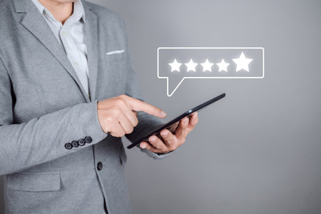 Man give rating to service experience on online application. Customer review satisfaction feedback survey concept.の写真素材