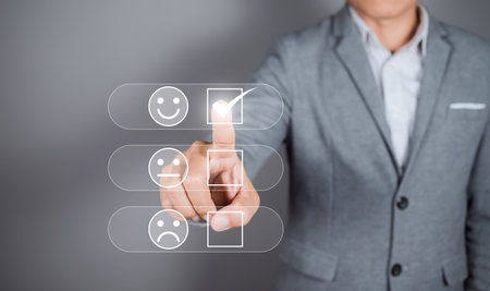 Man give rating to service experience on online application. Customer review satisfaction feedback survey concept.の写真素材