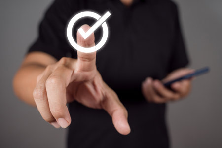 Man choose options Check mark icon. meaning to standard quality control certification assurance guarantee.の写真素材