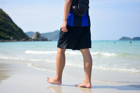 man walking on the beachの写真素材