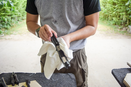 man clearing gunの写真素材