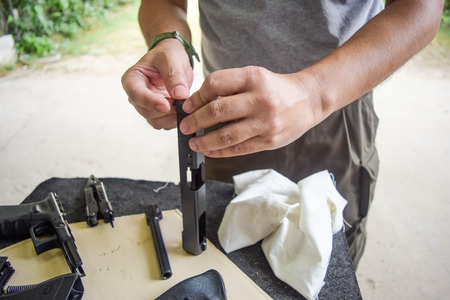 man clearing gunの写真素材