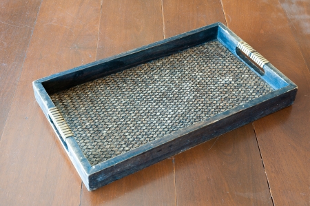 Thai style bamboo and wooden tray on wooden tableの写真素材