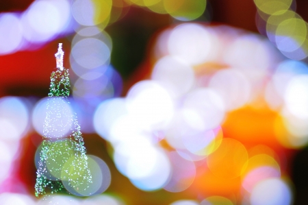 The bokeh with Christmas tree backgroundの写真素材