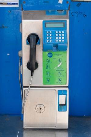 Old public telephone coin in Thailandの写真素材