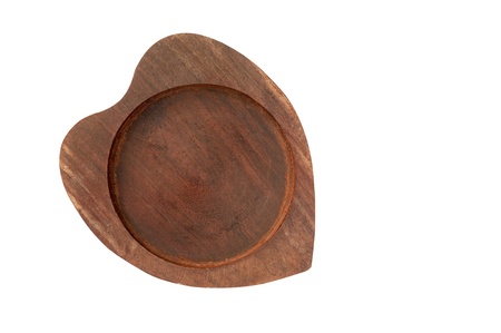 hand craft wooden saucer heart shape, wooden bottom plate isolated on whiteの写真素材