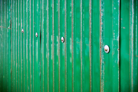 Green metal sheet with boltの写真素材