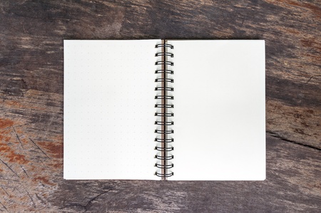 Open blank note book on grunge wood