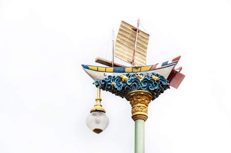 antique boat lamp pole on white backgroundの写真素材