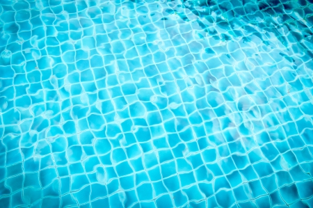 pool with blue ceramic tiles and water ripple effectの写真素材