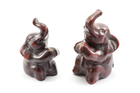 macro shot of wooden Asian elephants statue on white backgroundの写真素材