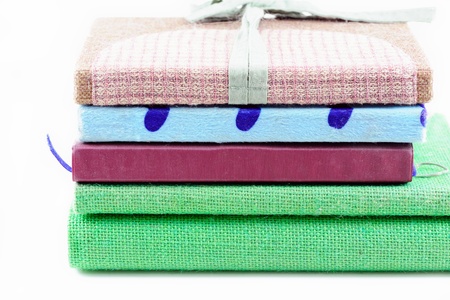 Stack of various ring note book on white background
