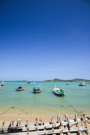 Traditional Thai Longtail fisherman boat on the beach, rawai beach, Phuket Thailandの写真素材