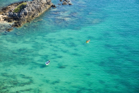 kayak floating on turquoise transparent water 	の写真素材