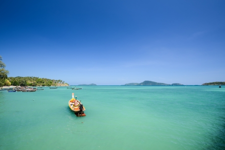  Traditional Thai Longtail fisherman boat on the beach, rawai beach, Phuket Thailand 	の写真素材