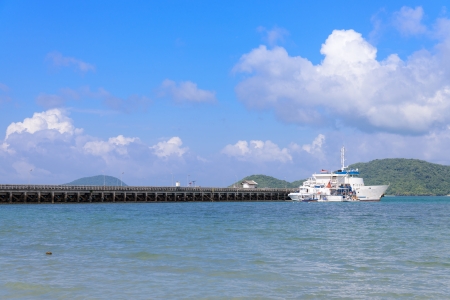 Concrete walk bridge across the sea with the blue sky at cape panwa, phuket Thailand の写真素材