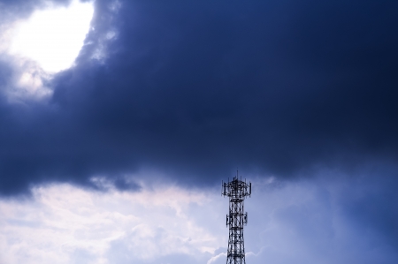 silhouette of Telecommunications tower in rain cloud の写真素材