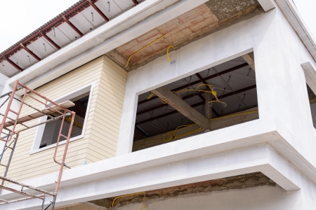 building in construction site with scaffolding の写真素材