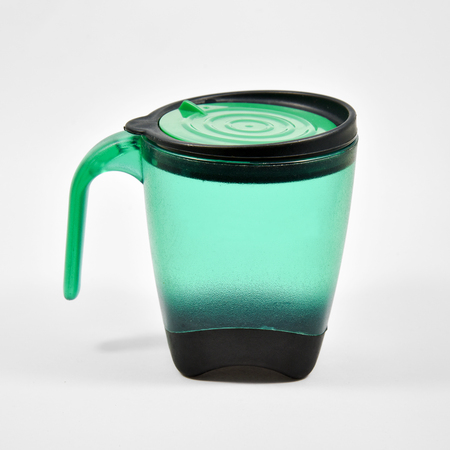 transparent green plastic coffee cup with cap