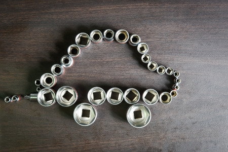 ratchet (socket) wrench sorting to be Car shape on wooden backgroundの写真素材