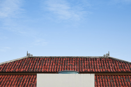 view top of contemporary building with cloudy sky, old red roof tileの写真素材
