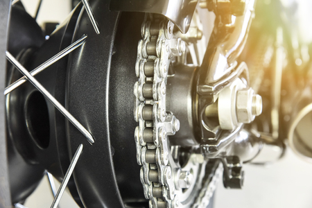 close up of motorcycle rear drive chain with selected focus shallow depth of fieldの写真素材