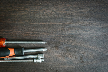 a set of socket screw divers lying on a wooden background with a copy space for textの写真素材