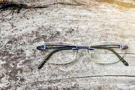 Clear eyeglasses, Glasses rimless frame contemporary style on grungy wood backgroundの写真素材